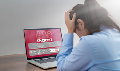 Stressed business woman with computer screen showing personal files encrypted text, Ransomware...