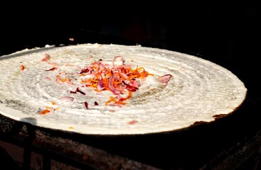 Closeup of Dosa with Selective Focus Isolated on Black Background in Horizontal Orientation