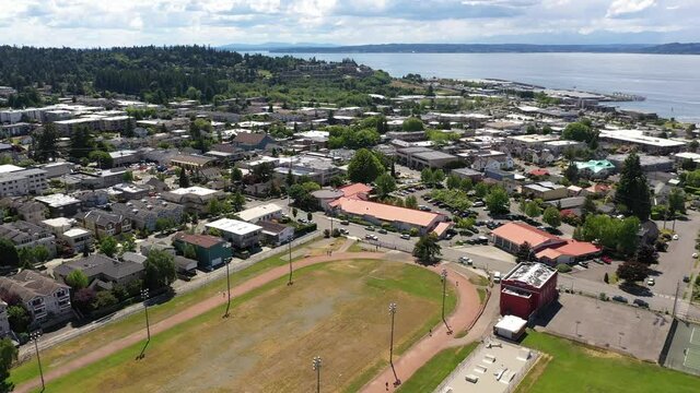Cinematic 4K drone clip of the downtown Edmonds commercial area, Kingston ferry terminal waterfront marina, near Seattle in Western Washington, Pacific Northwest, in Snohomish County