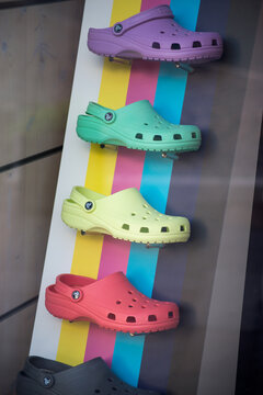 Mulhouse - France - 13 June 2021 - Closeup of plastic colorful  shoes collection by crocs in a fashion store showroom