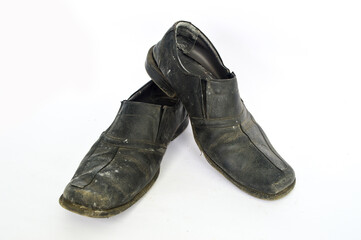 Old dirty shoes isolated in white background