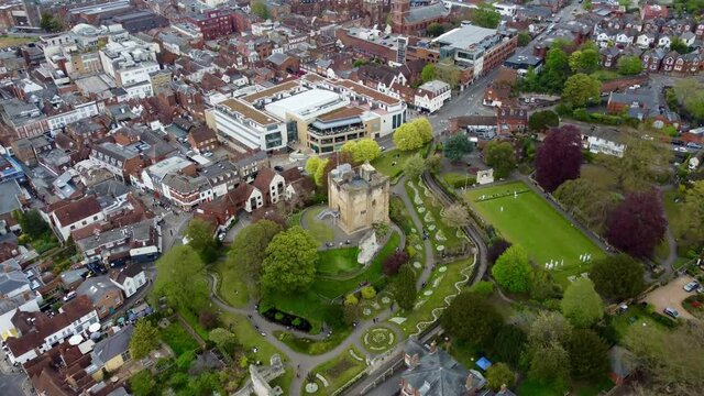 Overhead footage of an English town and castle.  Guildford. 4k.