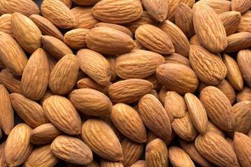 Overhead shot of raw almonds filling the frame.