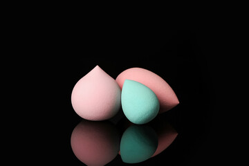 Makeup sponges on dark background