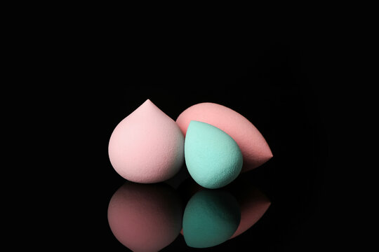 Makeup sponges on dark background