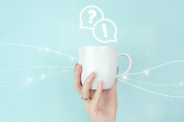 FAQ frequently asked questions concept. Girl hand hold morning coffee cup with FAQ question answer...