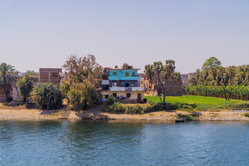 Fototapeta premium Panoramic view of traditional houses on the banks of the Nile River near Edfu, Egypt