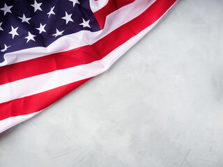 American stars and stripes flag on gray concrete background