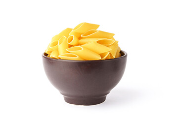pasta isolated on white Penne rigate pasta in a brown earthenware dish.