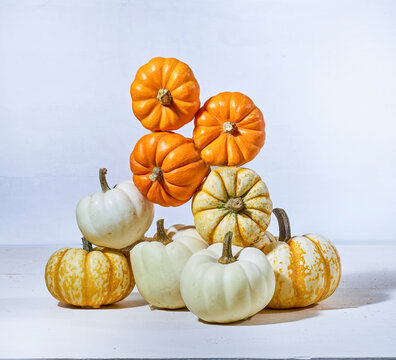 A stack of pie pumpkins balanced in a big tower - fall fun