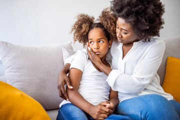 Loving worried mom psychologist consoling counseling talking to upset little child girl showing...