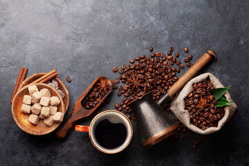 Roasted coffee beans, Turkish jezve, coffee cup and sugar
