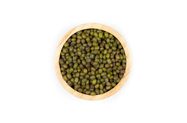 Dried green soybean seeds in a wooden cup on a white background.