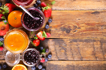 assortment of jam and fresh fruits