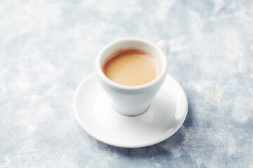 Obraz na płótnie Canvas Cup of coffee on bright wooden background. Copy space.