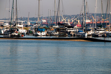 Fototapeta premium Yachts in Durban Harbour with Cargo Ships across Bay
