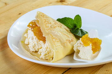Pancake with cottage cheese and jam