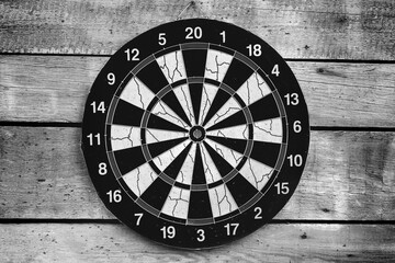 Dartboard mounted on a wooden wall