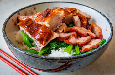 Roast meats and vegetables with rice.
