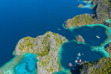 Aerial view of beautiful lagoons and limestone cliffs on Coron, Palawan, Philippines.