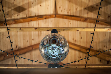 disco ball on wooden ceiling