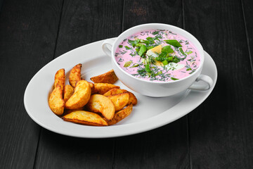 Cold beet soup with potato wedges