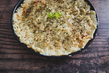 vegan lentil cottage pie with mash potato topping before going in the oven, healthy plant-based food