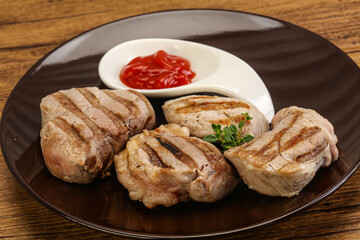Grilled pork tenderlion with tomato sauce
