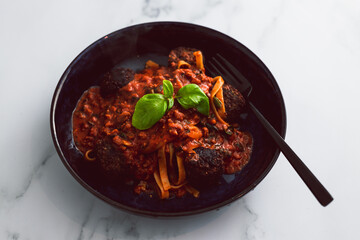 spaghetti bowl with vegan meatballs, healthy plant-based food
