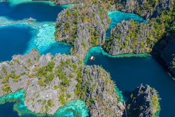 Aerial view of turquoise tropical lagoon with limestone cliffs in Coron Island, Palawan,...