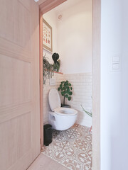 Small modern bathroom with multiple plants. Tropical jungle concept.