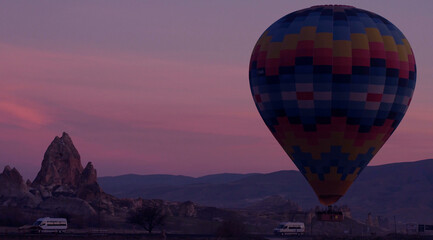 Sunset hot air balloon ride scene. Hot air balloon basket sunset silhouette.