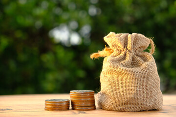 Stack of coin on table background and business or finance saving money, Advertising coins of finance and banking, Gold coins stacked on table background