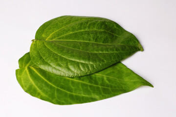 Fototapeta na wymiar Isolated Indian Pan Refreshment, Green betel leaf on white background. Famous in India, Pakistan and Bangladesh.