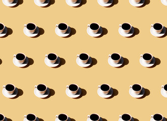 Pattern of coffee cup and plate, shadow of sun on beige terracotta background