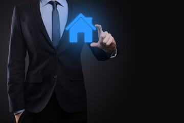 Real estate concept, businessman holding a house icon.House on Hand.Property insurance and security concept. Protecting gesture of man and symbol of house.