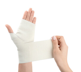 Woman applying medical bandage onto hand on white background, closeup
