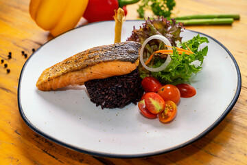 Salmon Don, Fusion Food. Braised grilled salmon with black rice.