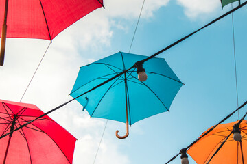 Colorful umbrellas in the sky. Multicolored umbrellas in the sky, creating a summer, art mood on the street