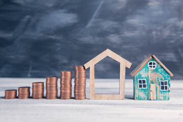 coins in the form of a diagram and a house