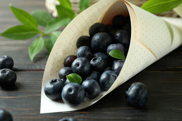 Fresh berry concept with blueberry on wooden table