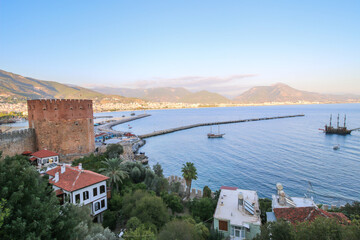 Landscape view of Alanya from red Castle hill, Turkey, marina, sea and mountains from the top of the fortress wall.