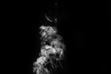 Smoke fragments on a black background. Abstract background, design element, for overlay on pictures