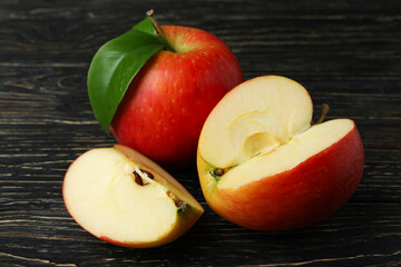Naklejka na ściany i meble Tasty ripe red apples on wooden table