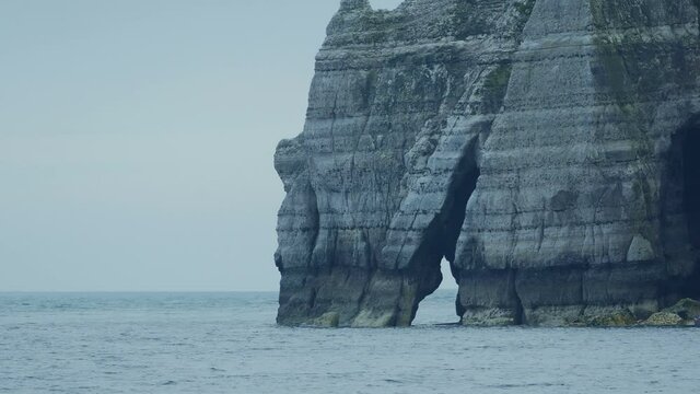 Cliffs With Natural Archway By The Sea