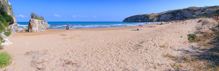 Obraz premium The most beautiful beaches of Apulia: Zaiana Bay, enclosed by two rocks, stretches a few kilometres away from Peschici, in Gargano, Italy.