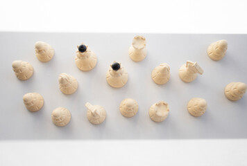 chess, white pieces on a light table surface, indoors. Intellectual games for children and adults, logic, thinking, chess on the table