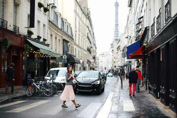 Beautiful girl walking in romantic paris