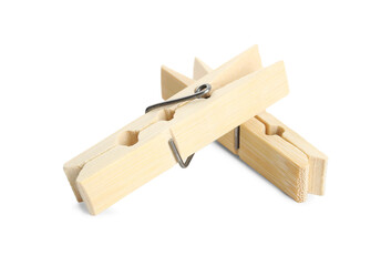 Two classic wooden clothespins on white background