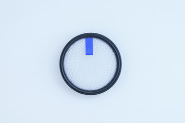 New clean round removable vacuum cleaner filter on white background.